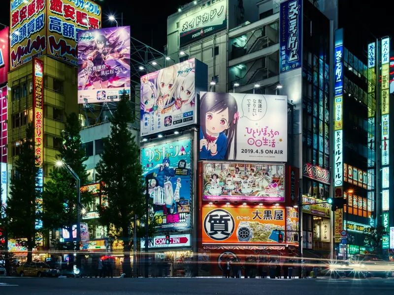Anime billboards in Akihabara at night